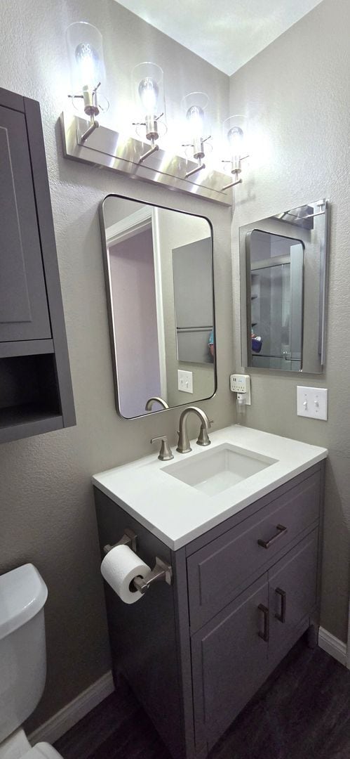 Building Photo - Two story 2 bedroom townhome with newer flooring, paint & appliances - community pool!