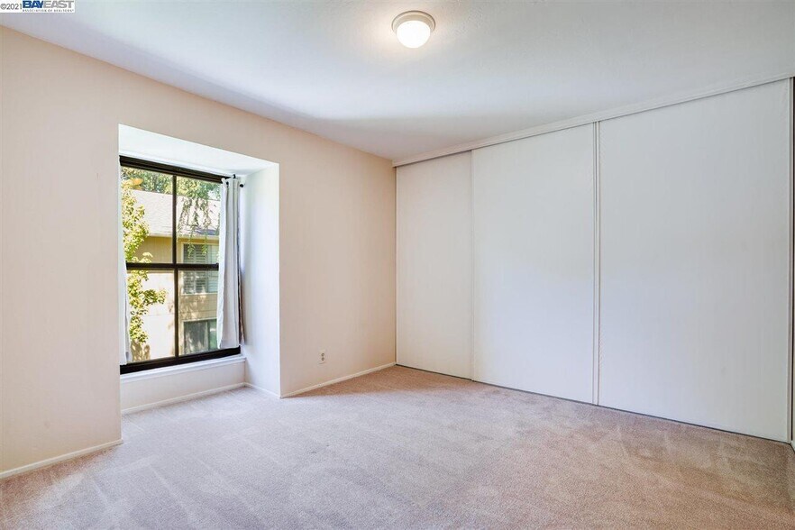 2nd bedroom with full closet- now has wooden flooring - 9005 Alcosta Blvd