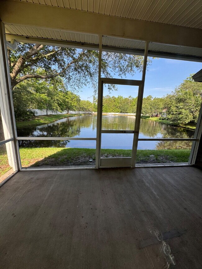Building Photo - Spacious 4 Bedroom Pond-View Home with Upg...