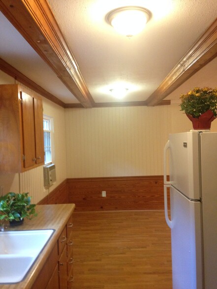 This is a shot from the far end of the kitchen to the dining area. - 2680 Ballsville Road