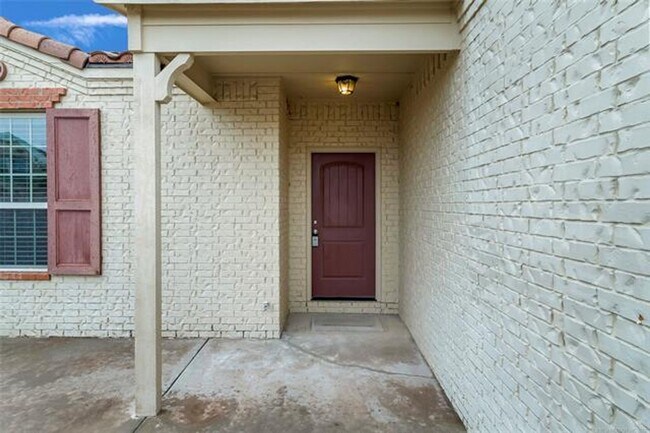 Building Photo - Welcome to this inviting Mediterranean-style patio home