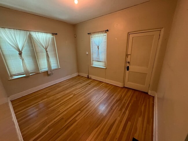 Building Photo - 4 Br, 2 Ba with kitchen appliances and basement for added storage.