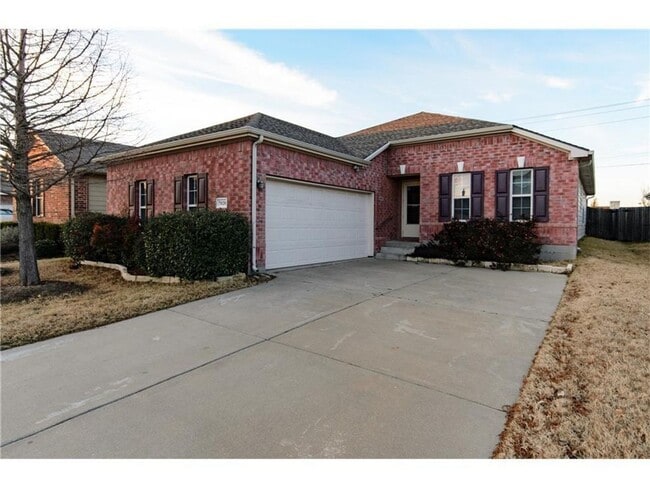 Building Photo - Beautiful single-story home with a front g...