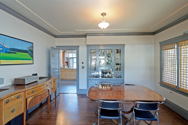 Dining room showing built-in cabinets and kitchen to the left. - 2835 Georgia St