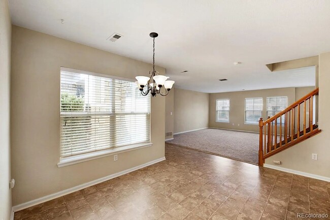 Building Photo - LEASING SPECIAL! Bright Open-Concept Condo with 1-Car Garage in Prime Commuter Location