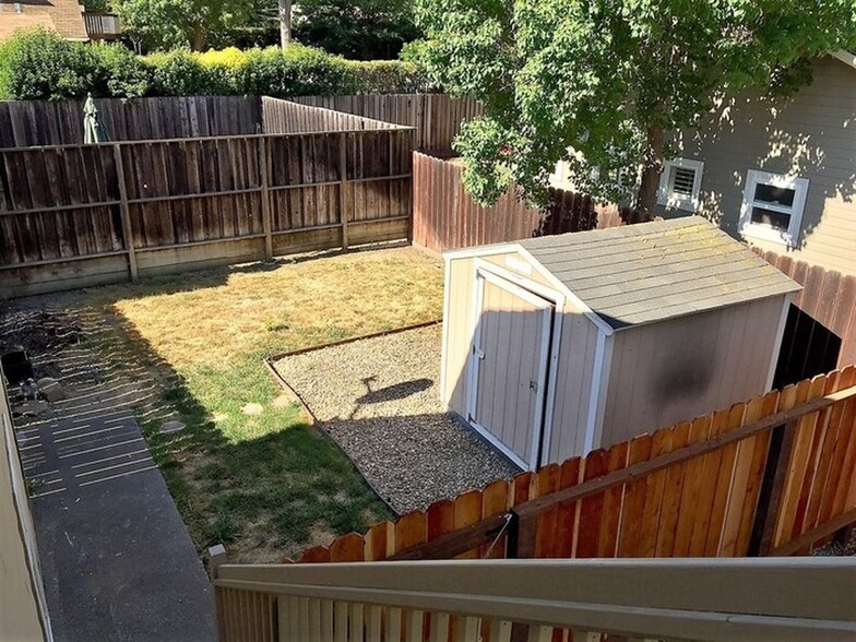 private back yard includes storage shed. - 1839 San Luis Rd