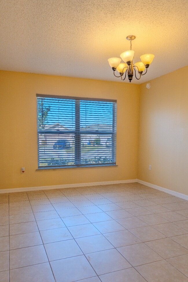 Building Photo - Spacious 4-Bed Groveland Home with Attached Garage, Central Air, and Private Patio