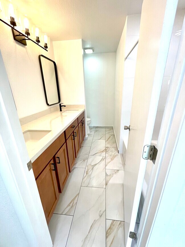 HALL BATH HAS DUAL SINKS - 42 W 6th Pl