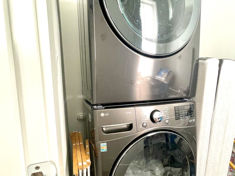 In-unit washer & dryer inside laundry room (shelving for pantry goods also available, if desired) - 4127 40th Ave SW
