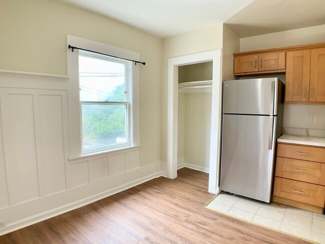Building Photo - TOP FLOOR, Corner Studio. Hardwood Floors!...