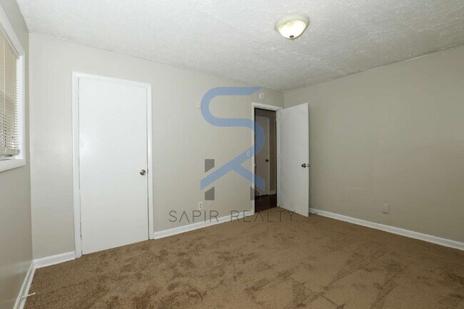 Building Photo - Timeless All-Electric Ranch Charm in a Vibrant, Peaceful Corner of South River Gardens