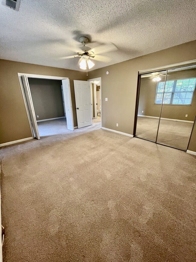 Master bedroom with sliders leading to closet - 1458 High School Dr