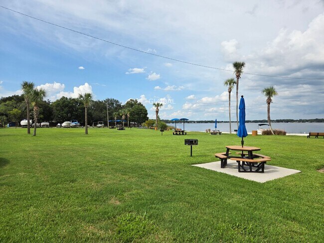 Building Photo - Lakefront First-Floor Condo in Camelot by ...