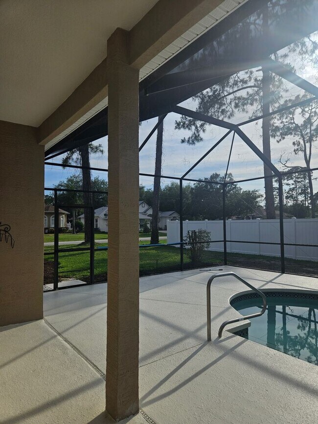 Building Photo - 4 BEDROOM 3 FULL BATH HOME WITH A SCREENED IN POOL IN THE BEAUTIFUL PALM COAST