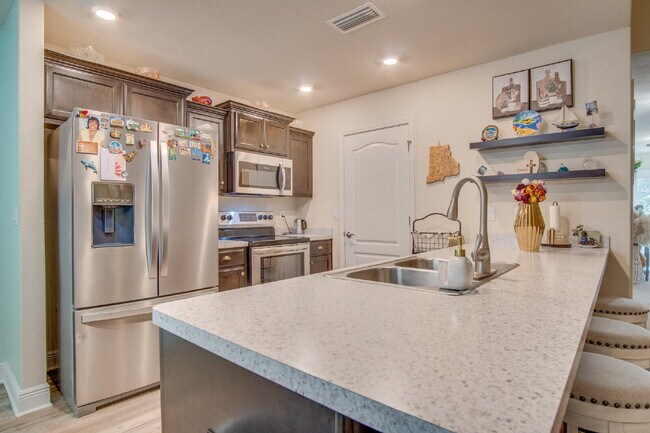 Building Photo - Spacious Cottage-Style Home Near UWF, Navy Federal & West Florida Hospital with Private Upstairs ...