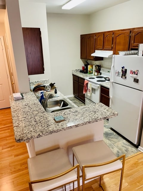 Kitchen with fridge, stove, and dishwasher - 2700 Pine Tree Rd NE