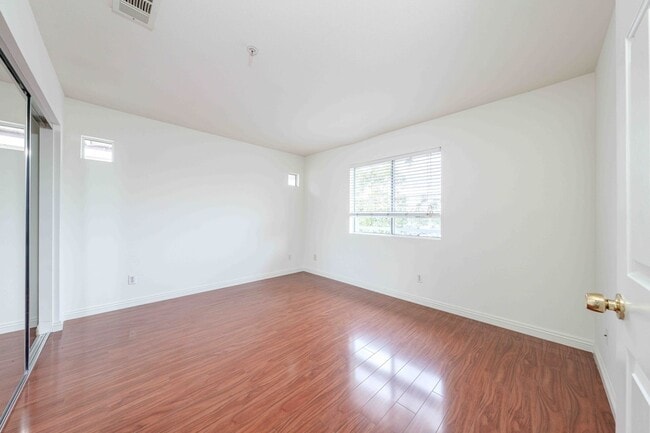 Building Photo - Gated Townhome with Updated Kitchen and Private Backyard