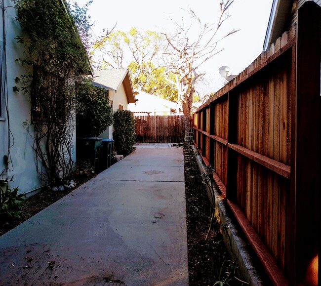 Located tucked away from street, to gated entrace opening to patio - 1355 1/2 E Elizabeth St