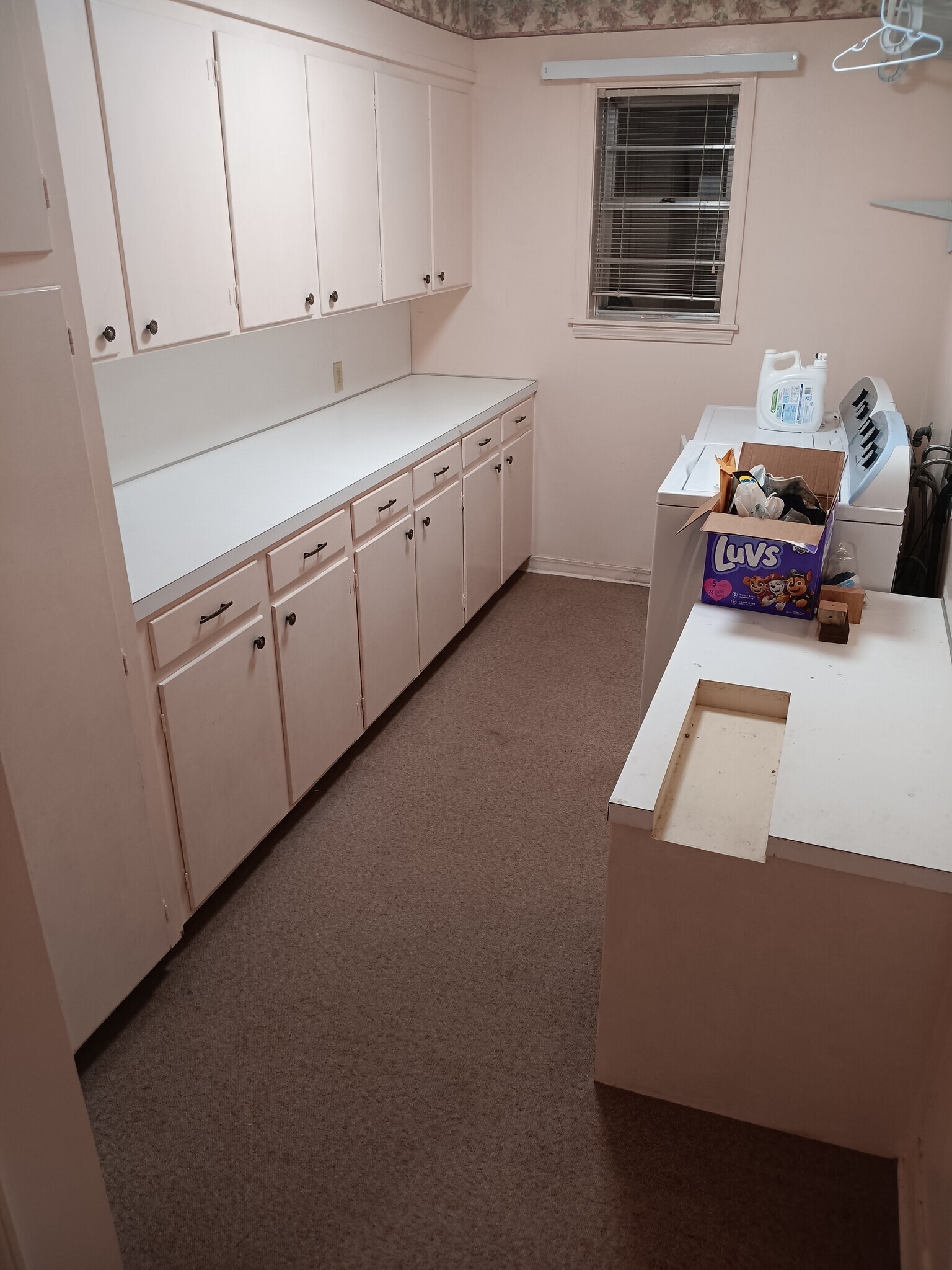 Built-in sewing desk & cabinetry provides great storage in laundry room. Washer/dryer not included - 2308 Wesley Cir