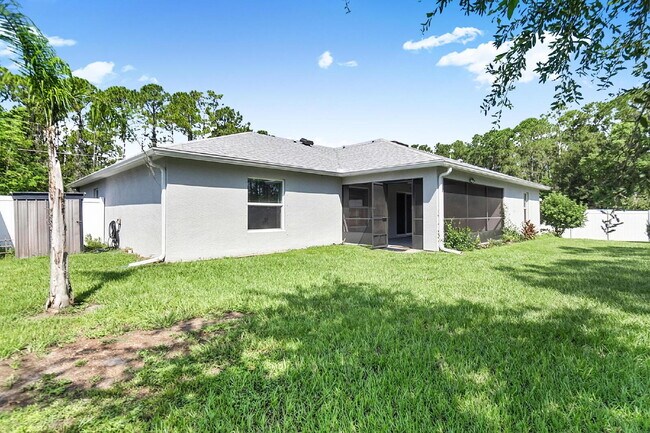 Building Photo - Modern 4-Bedroom, 3-Bath Home with Private In-Law Suite – Palm Coast, FL