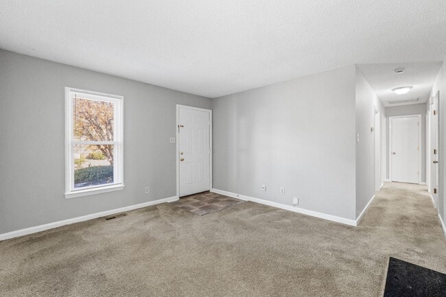 Building Photo - NE Home - Updated Kitchen and Bathrooms!  SS Appliances, Fire Place, Front Porch & Deck, Fenced Y...