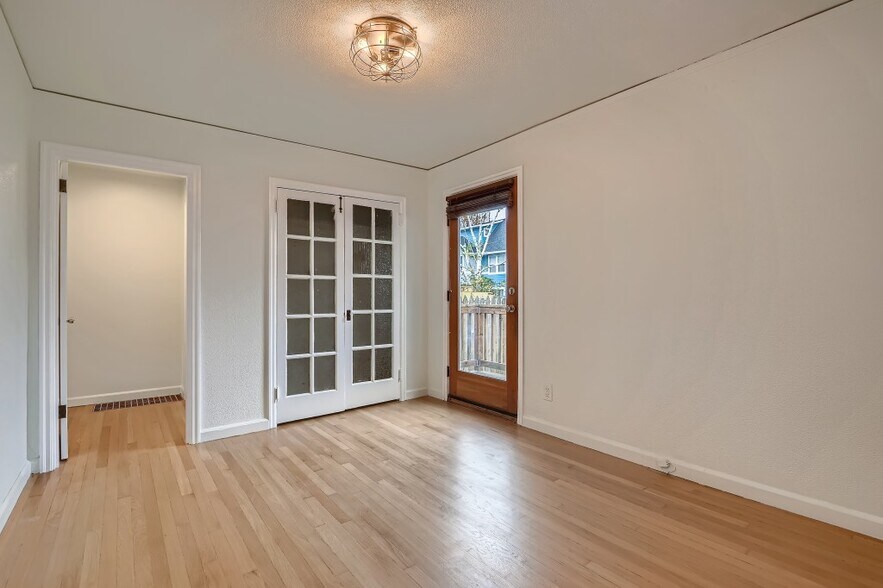 1943 touches throughout like leaded glass closet door on main level bedroom - 451 NE Sumner St