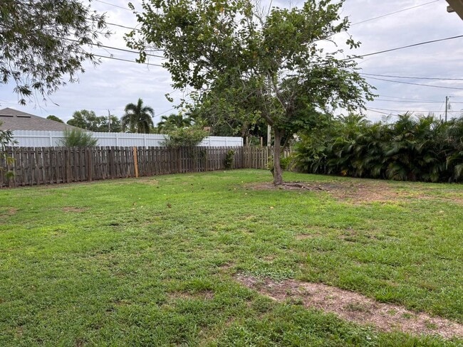 Building Photo - 2/2/1 home with a spacious fenced backyard...