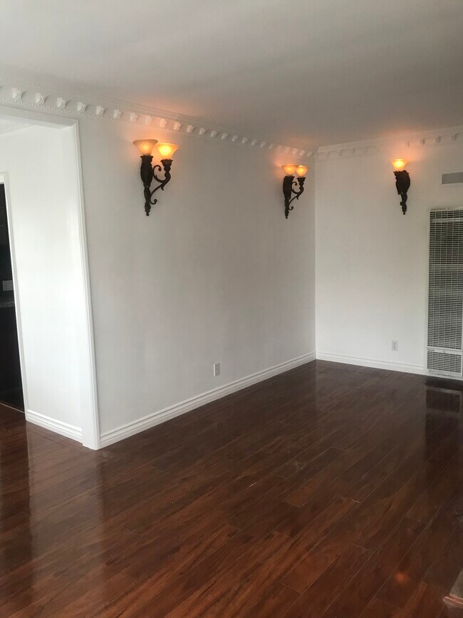Beautiful living room with beautiful floors throughout the unit. - 1857 Pandora Ave