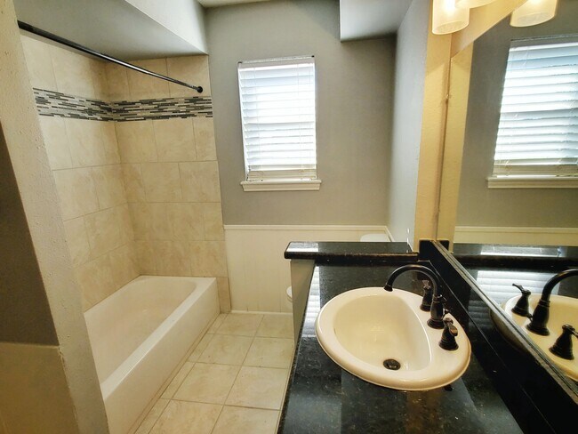 Tiled hallway bathroom is also accessible from bedroom 4. - 37438 Meadowview Dr