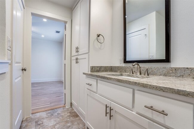 Building Photo - Beautiful townhome featuring granite countertops, hard wood floors, and a small private yard grea...