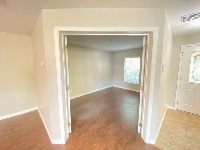 Building Photo - Avalon Park corner end Townhome featuring 3 bedrooms, 2.5 baths, plus office, and 2 car garage.