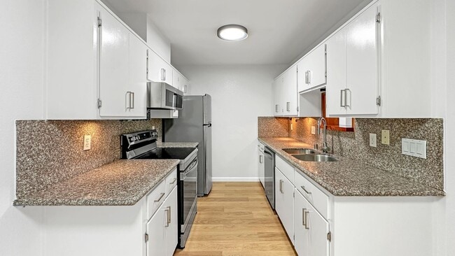 Building Photo - Waterfront Top-Floor West-Facing Apartment...