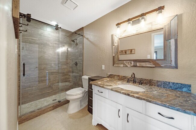 Building Photo - Welcome to your lakeside sanctuary in the ...