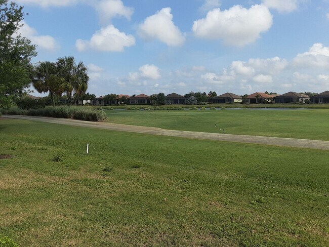 Building Photo - Seasonal/short term turnkey furnished Incredible 2/2 with den ground floor condo in resort Esplan...