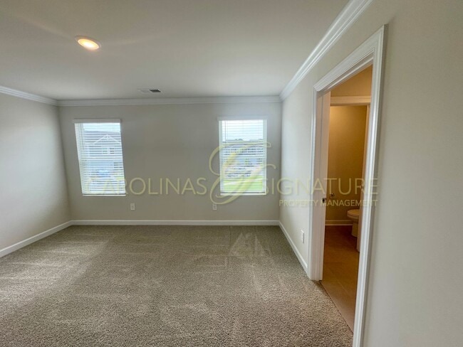 Building Photo - Beautiful New Construction Townhome in Uni...