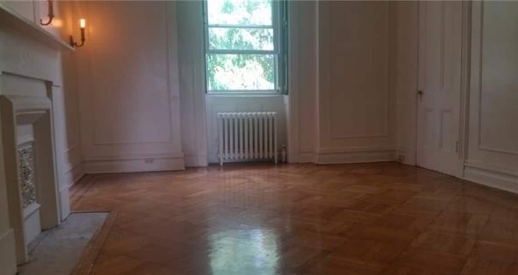 Functional shutters, hardwood flooring and fireplace mantle - 198 Hancock St