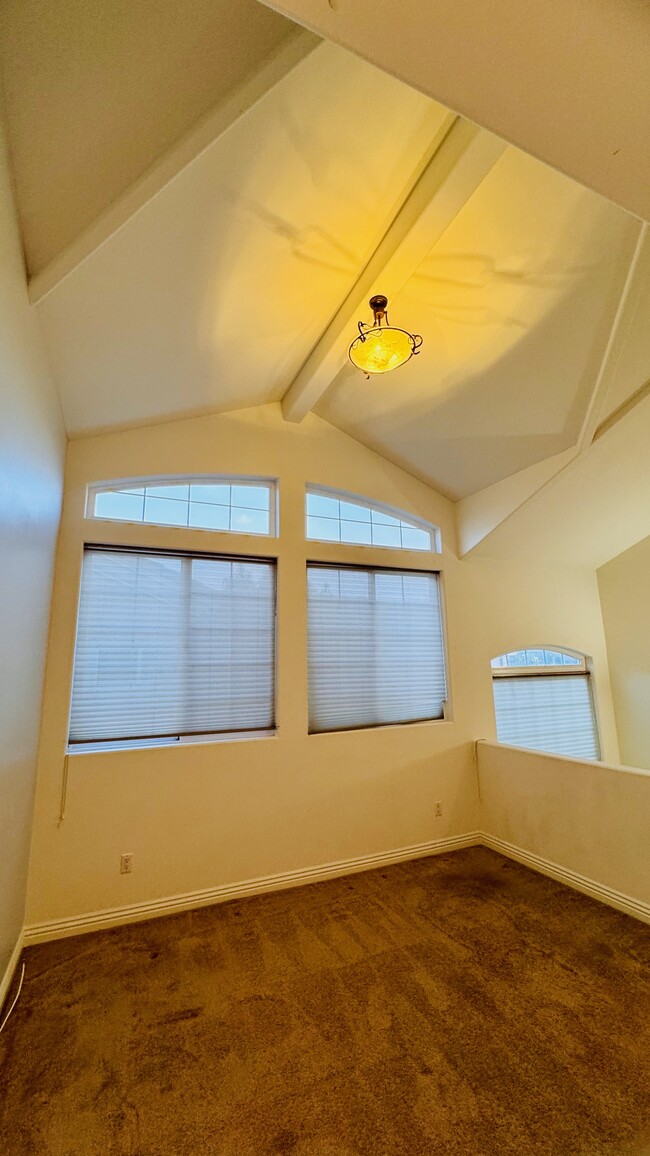 Upstairs family room with gigantic windows and high vaulted ceilings - 2107 Plant Ave