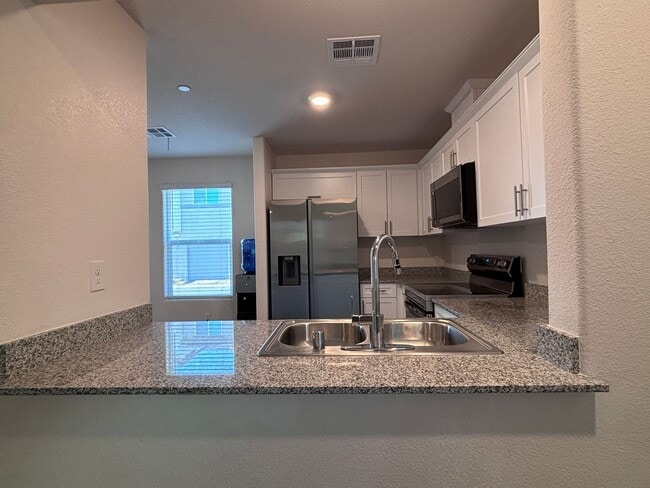 Building Photo - Modern 2024 Townhome in Gated Community with Resort-Style Amenities
