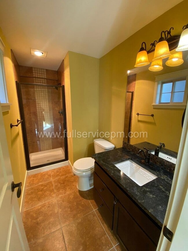 Building Photo - Spacious townhome with private backyard, garage parking, multiple decks, and a dedicated home off...