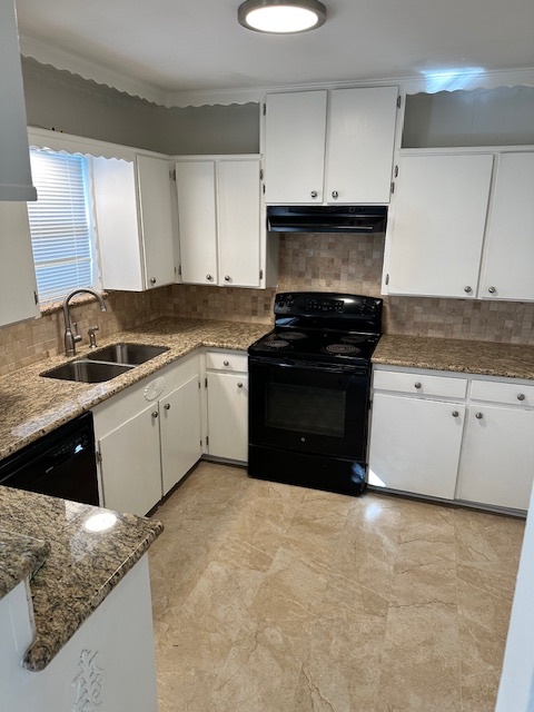 Kitchen with beautiful, durable granite counters and elegant tile backsplash - 128 Dallas St