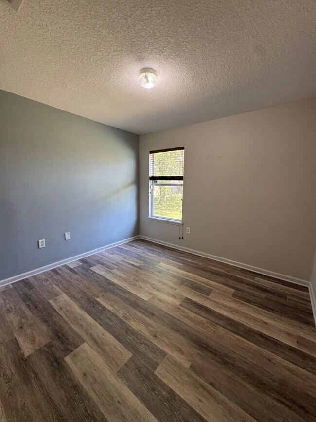 Building Photo - Spacious 4 Bedroom Pond-View Home with Upg...