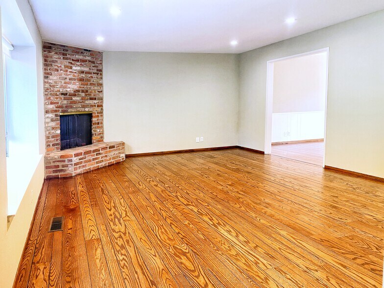 Living room has fireplace and windows seat - 315 Victoria Plz
