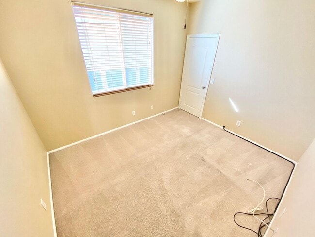 Building Photo - THIS SPACIOUS RESIDENCE FEATURES 4 BEDROOM...