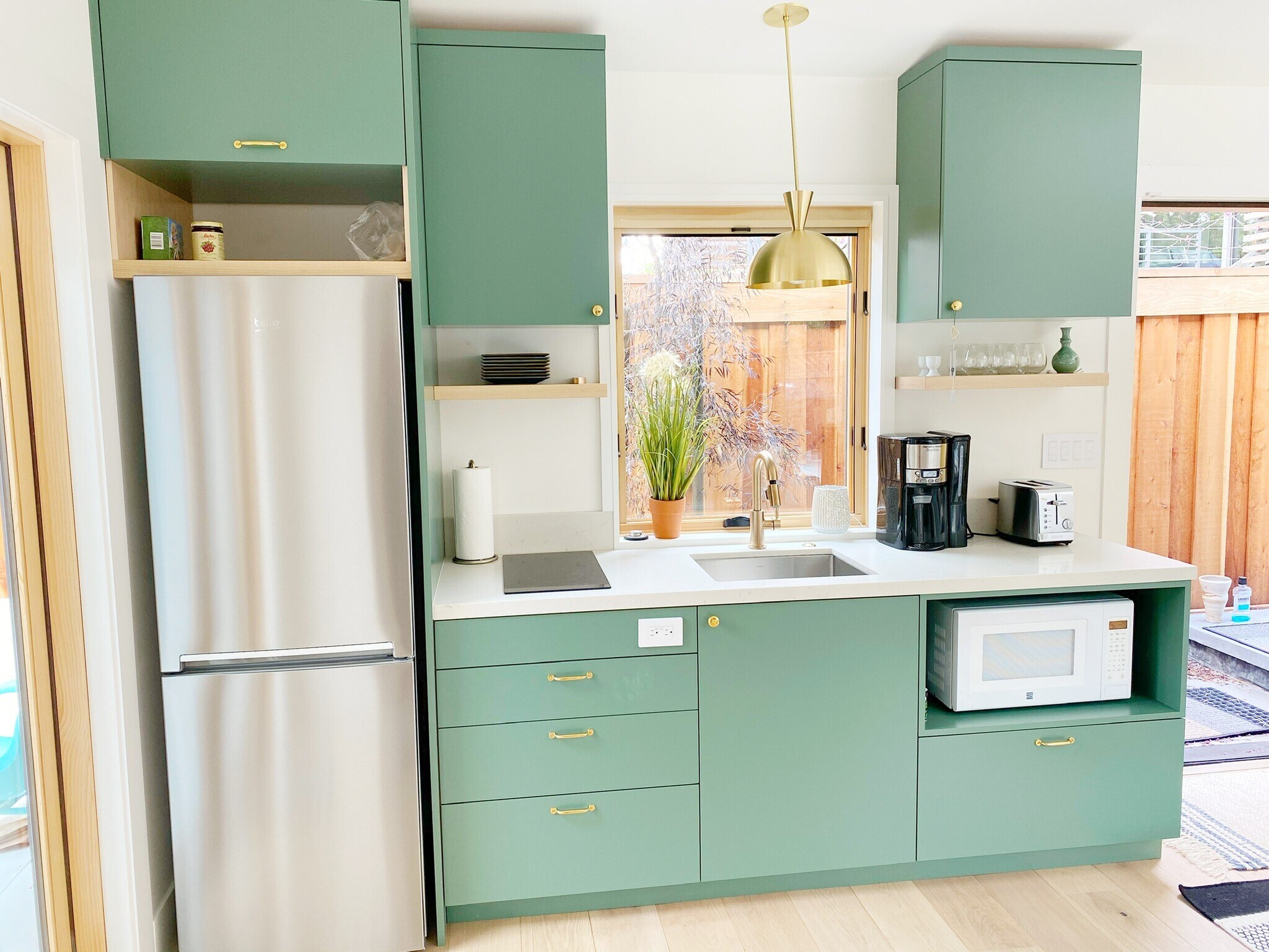 Full kitchen with 2 burner induction stove and combination microwave and convection oven. - 5579 Taft Ave