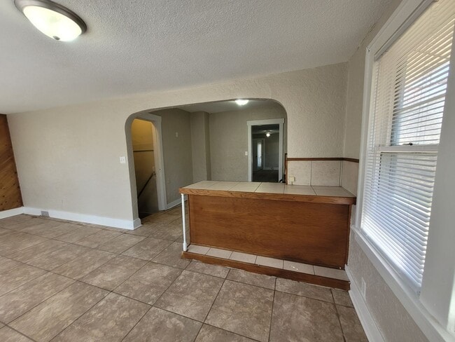 Building Photo - Four bedroom home on Indianola Ave with large yard and two decks!