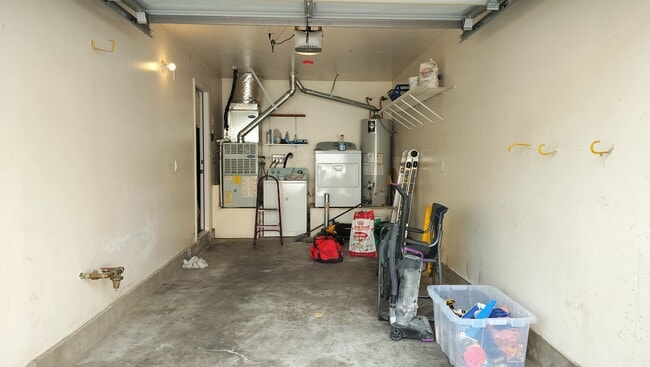 Building Photo - Townhome with Loft + Two Bedrooms/Baths - Designed for Comfort in Gated Community