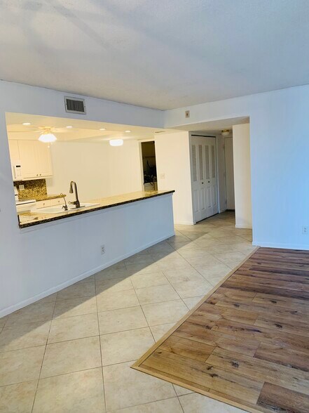 Open kitchen to siting room - 950 Egret Cir