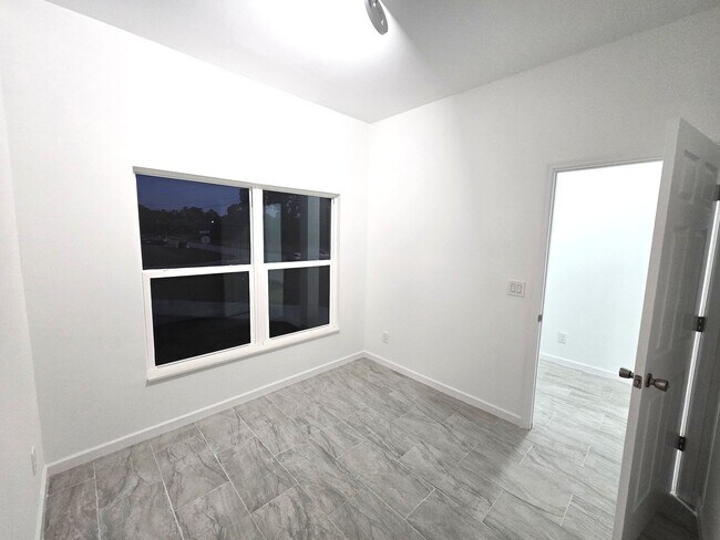 Building Photo - Brand-New 4BR/2BA Luxury Home with 2-Car Garage – Desirable 33971 Location