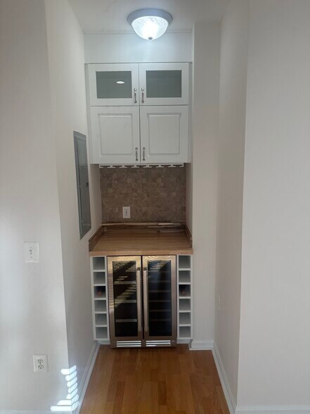 Built in bar and wine fridge off office area. - 4860 Eisenhower Ave