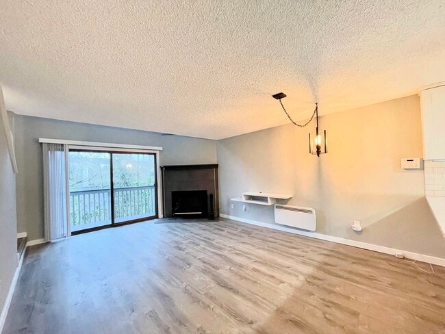 Building Photo - Charming 2-Bedroom Tukwila Townhome with Garage, Parking, Stainless Steel Appliances & Fireplace ...